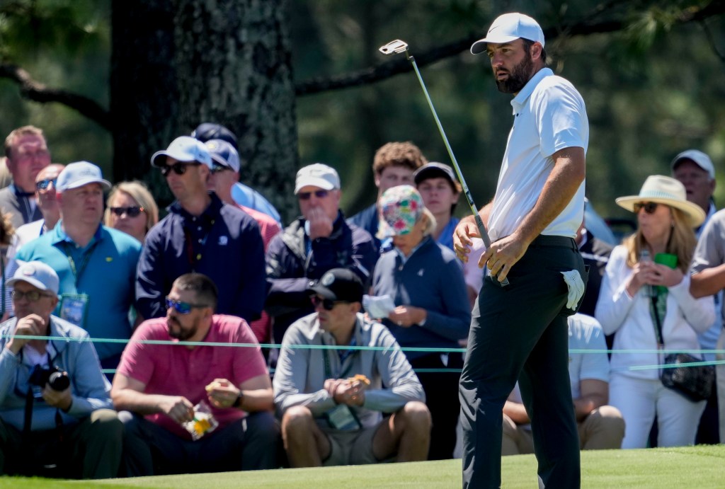 Scottie Scheffler watches a putt on the No. 7 green during his Masters practice round.