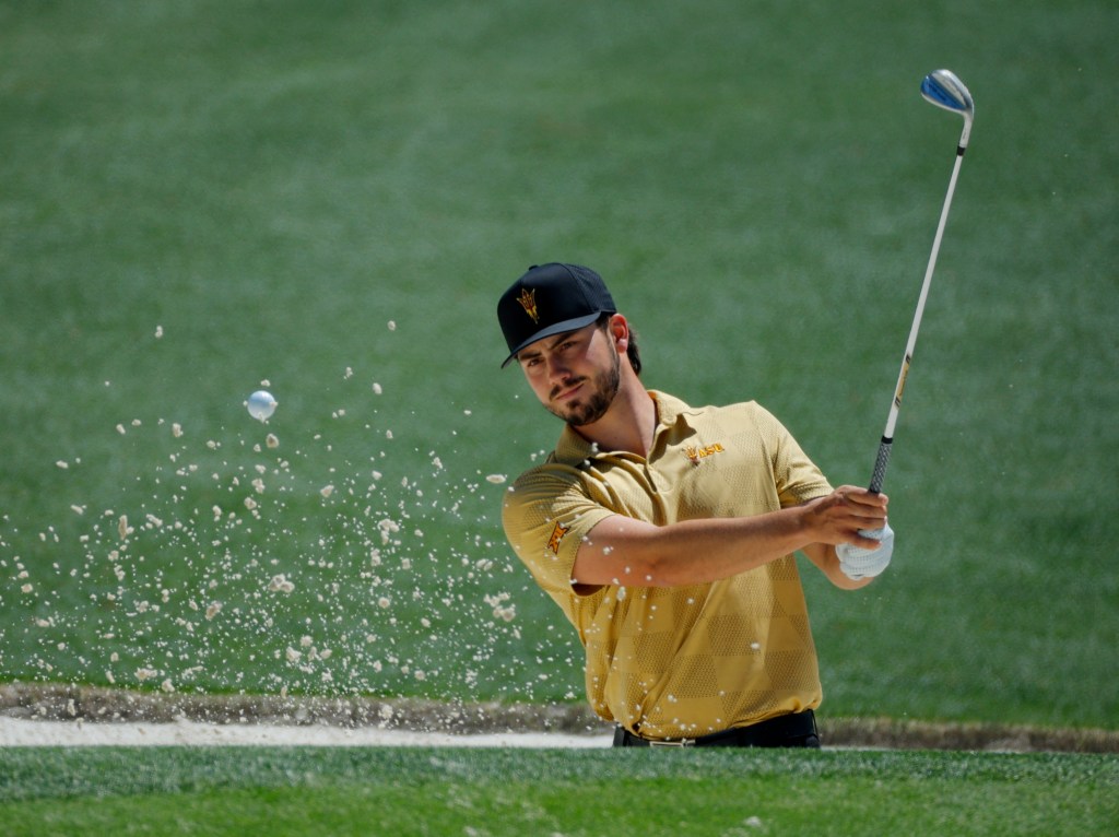 Spain's Jose Luis Ballester plays out from the bunker 16th hole during a practice round 