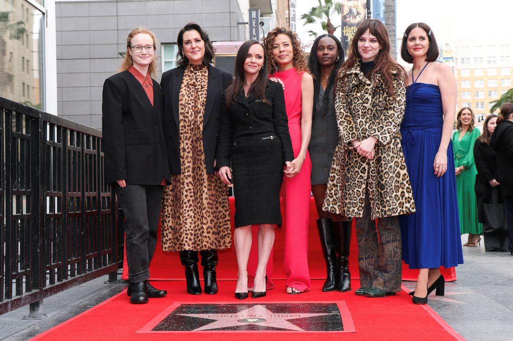 Christina Ricci poses for a photo with the cast members of "Yellowjackets", Liv Hewson, Melanie Lynskey, Tawny Cypress, Nia Sondaya, Sophie Thatcher and Ashley Sutton, during the unveiling ceremony for Ricci's star on the Hollywood Walk of Fame in Los Angeles on March 6, 2025. 