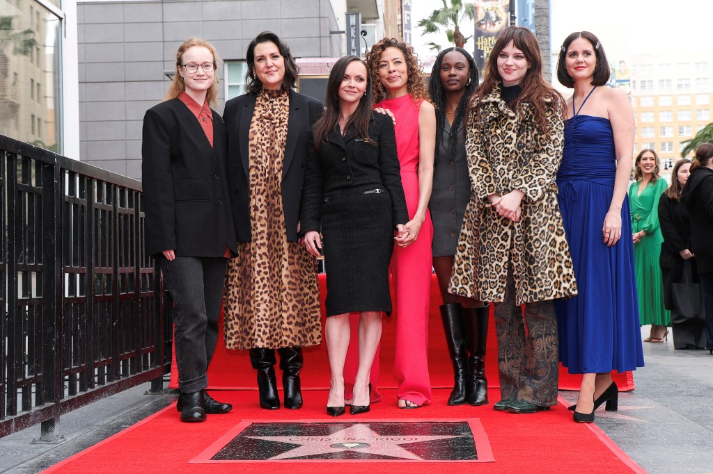 Christina Ricci poses for a photo with the cast members of "Yellowjackets", Liv Hewson, Melanie Lynskey, Tawny Cypress, Nia Sondaya, Sophie Thatcher and Ashley Sutton, during the unveiling ceremony for Ricci's star on the Hollywood Walk of Fame in Los Angeles on March 6, 2025. 