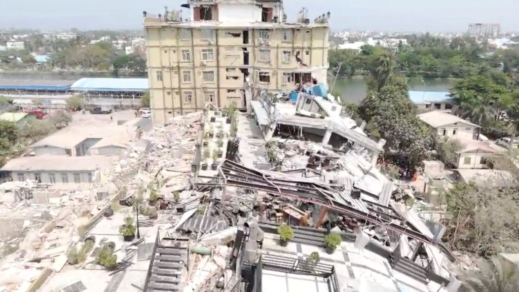 An aerial view shows flattened buildings and one damaged following an earthquake on March 28, in a location given as Mandalay region, Myanmar, in this screen grab obtained from a social media video released March 31, 2025.