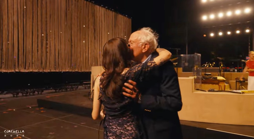 Bernie Sanders embraces Clairo after introducing her.