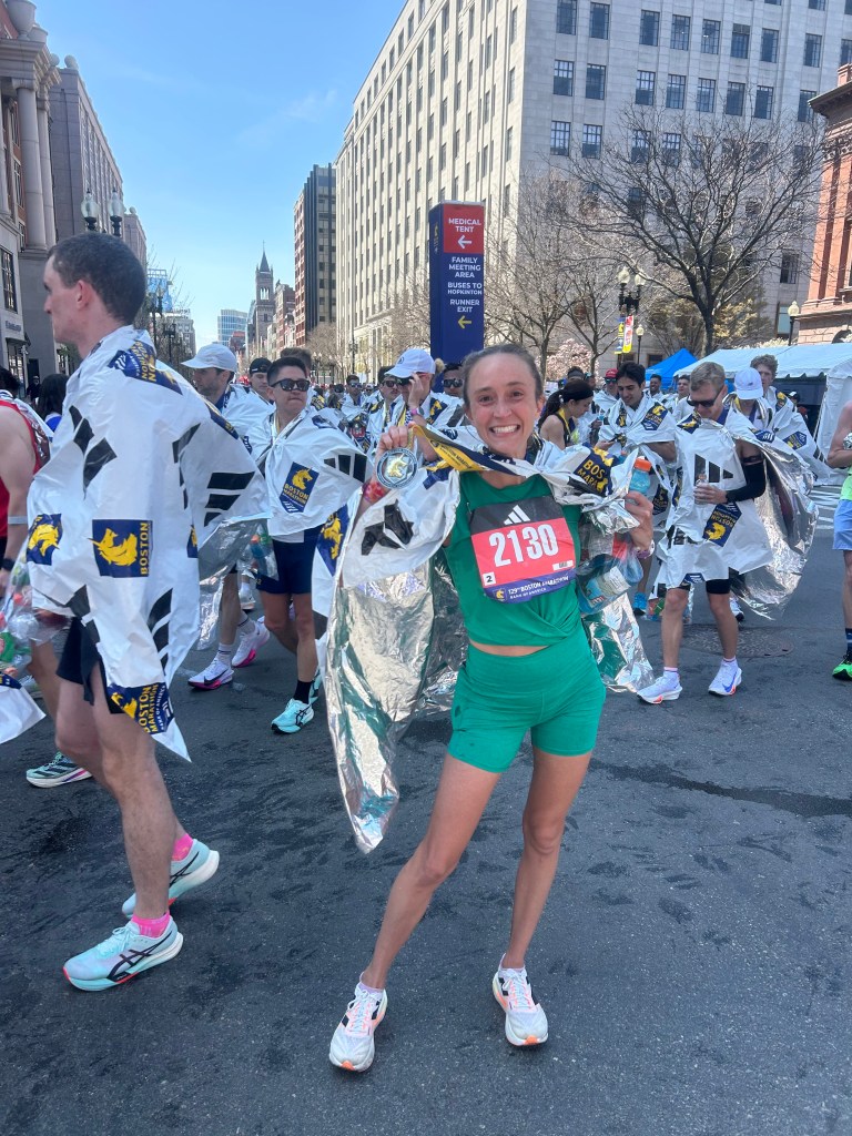 Natalie Daniels celebrates at the finish line.