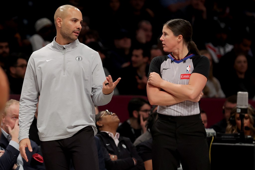 Brooklyn Nets head coach Jordi Fernandez in a discussion with referee Natalie Sago during a game against the Atlanta Hawks at the Barclays Center