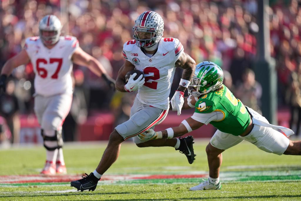 Emeka Egbuka runs with the ball during Ohio State's game Jan. 1.