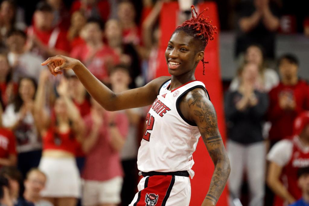 Saniya Rivers from North Carolina State celebrating during a NCAA match against Michigan State