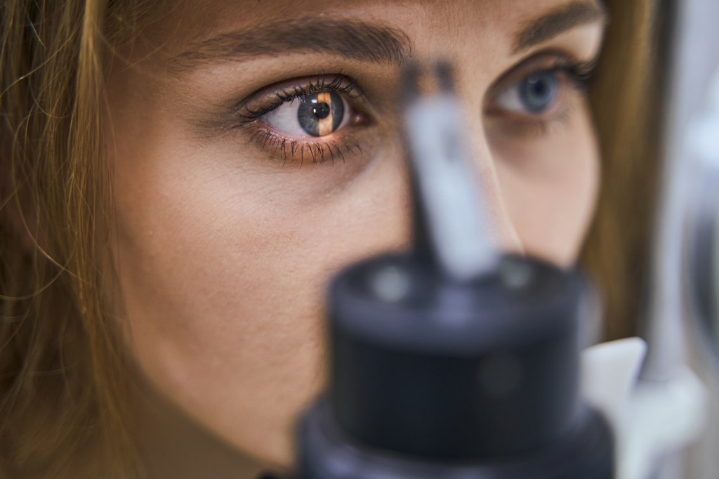 Vision problems have long been linked to cognitive decline, particularly in older adults. Here, a woman gets an eye exam.
