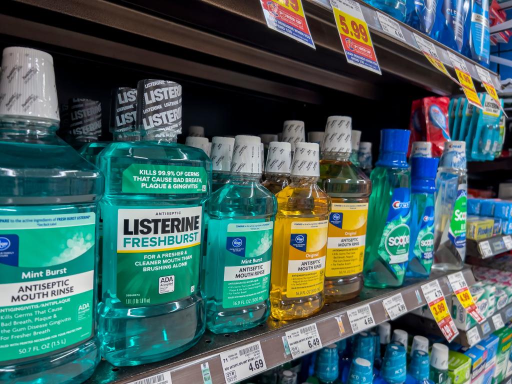 many bottles of listerine on a store shelf