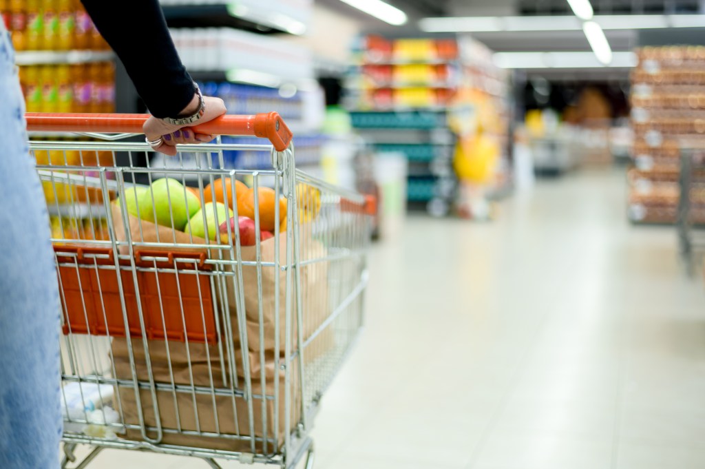 A woman shops for groceries. 