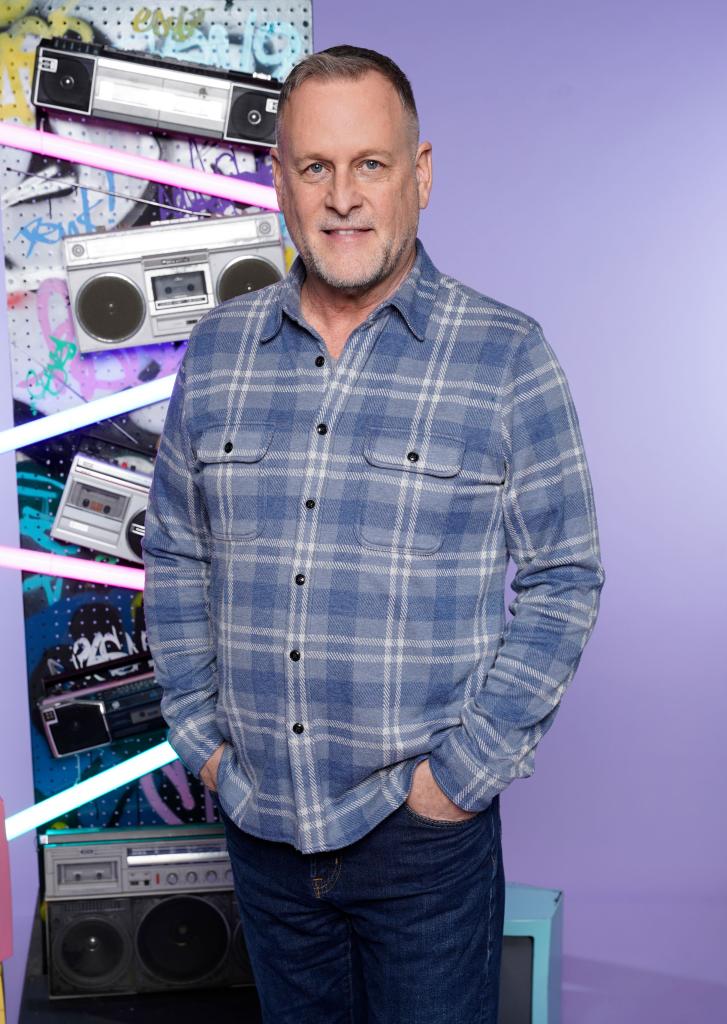 Dave Coulier standing in front of a graffiti wall at the 2024 Thats4Entertainment's 90s Con in Hartford, Connecticut