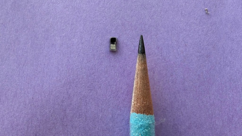 Tiny pacemaker next to a pencil tip