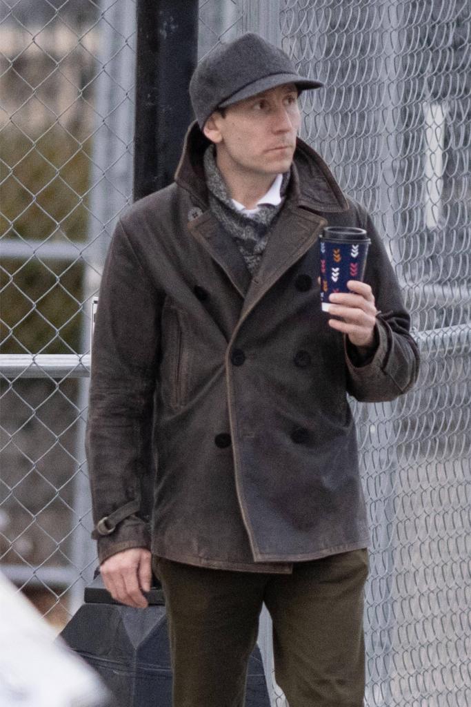 Erik Per Sullivan, known for his role as Dewey on the sitcom Malcolm in the Middle, is pictured leaving his house and picking up a coffee in Boston.