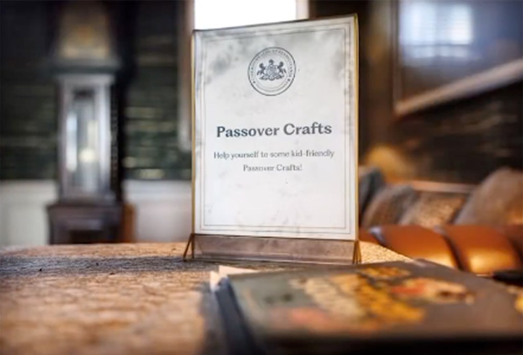 A photo of a burnt Passover craft sign in Shapiro's home.
