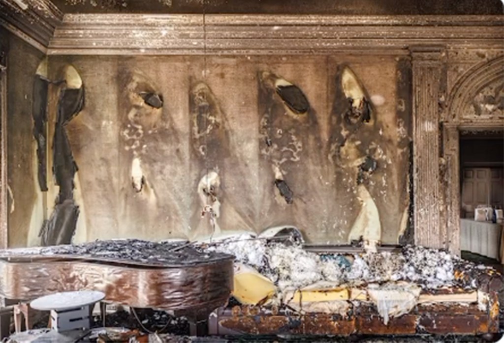 Charred interior of Pennsylvania Governor's residence featuring a burned piano after an overnight arson attack