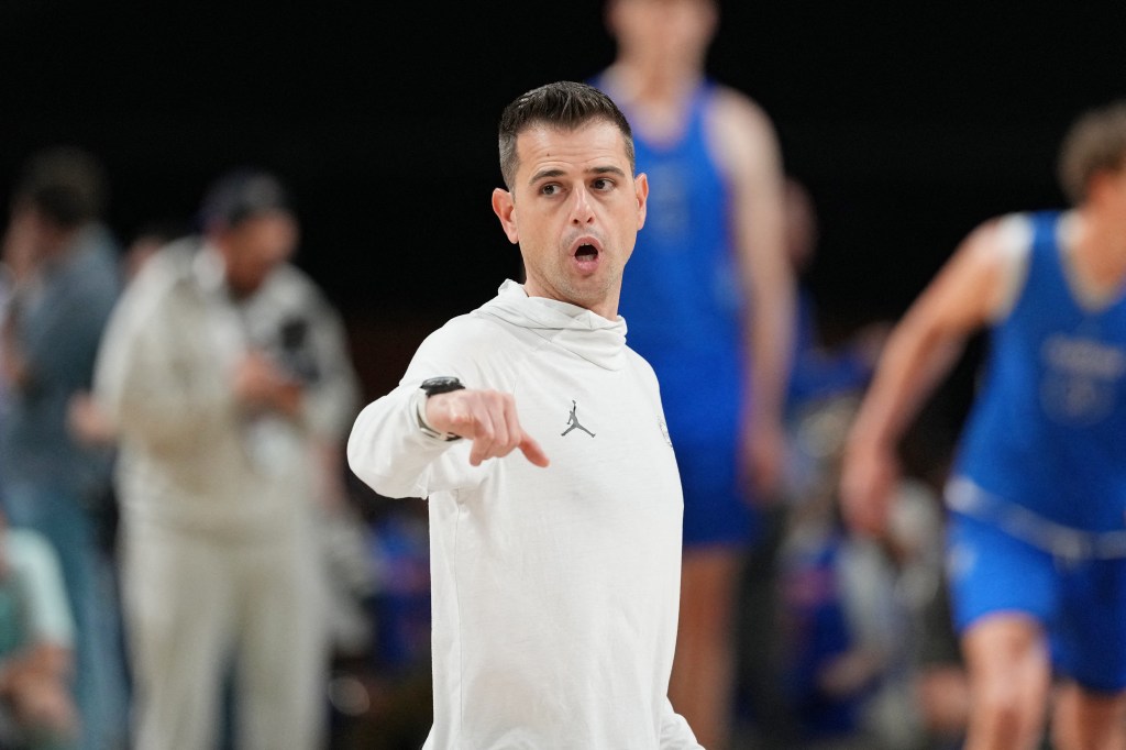 Florida head coach Todd Golden running a practice ahead of the Final Four.