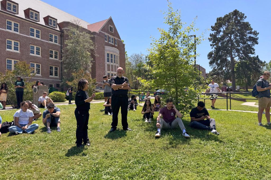Florida State University students wait for news amid an active shooter incident at the schools campus in Tallahassee, Fla., Thursday, April 17, 2025.