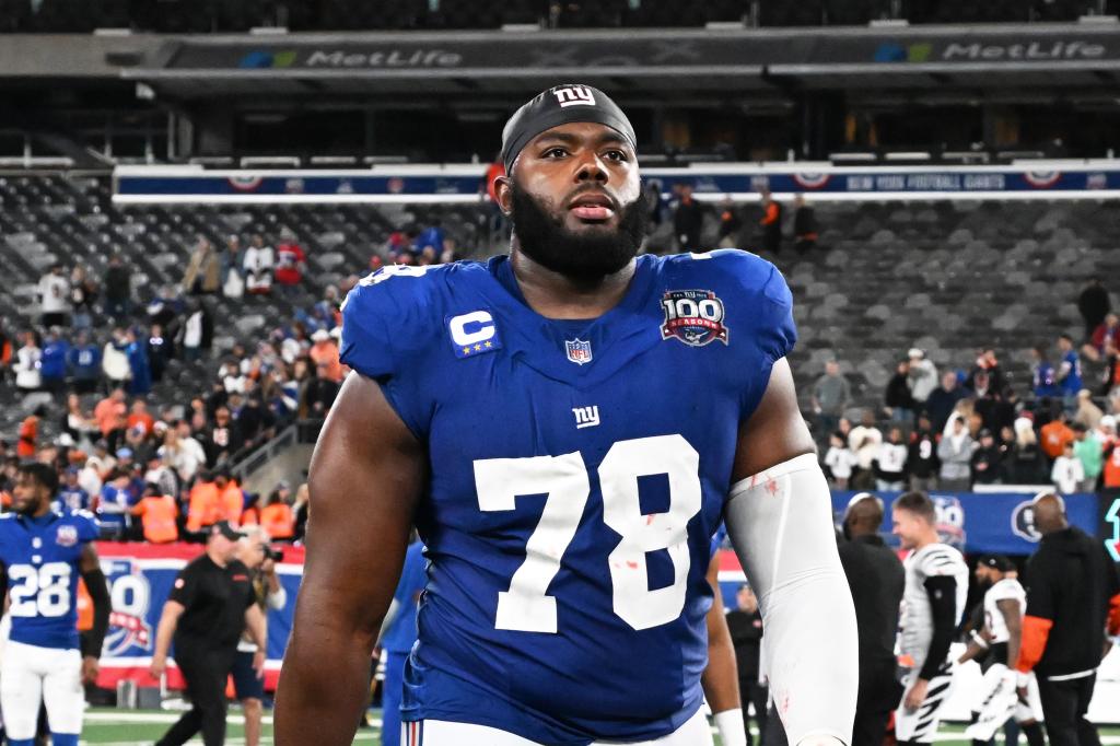 Giants offensive tackle Andrew Thomas in uniform, exiting the field after a game at MetLife Stadium, East Rutherford, N.J.