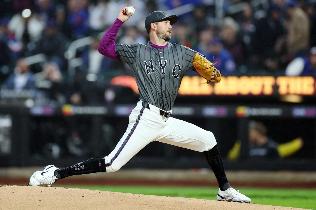 Griffin Canning of the New York Mets pitching a baseball during the first inning against the Toronto Blue Jays at Citi Field on April 05, 2025