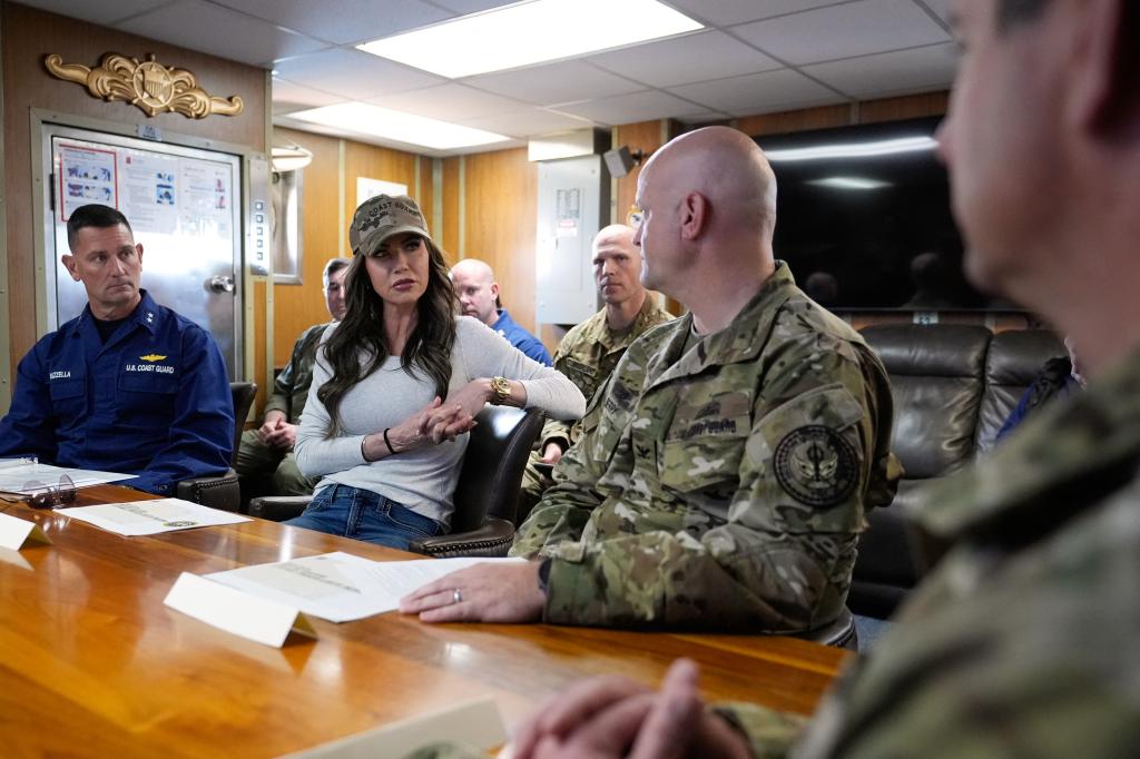 Coast Guard Rear Admiral Joseph Buzzella speaks with Kristi Noem during a briefing on board the US Coast Guard Cutter Elm on March 16, 2025.
