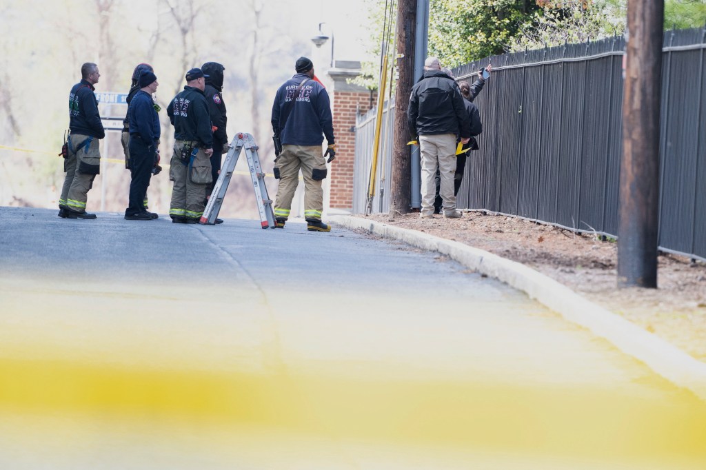 Investigators at the Harrisburg mansion after the attack.
