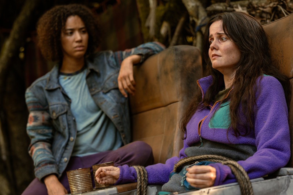 L-R: Jasmin Savoy Brown as Teen Taissa and Ashley Sutton as Hanna in "Yellowjackets" Season 3.