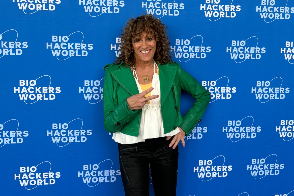 Julie (pictured here at Biohackers World) told The Post that she developed the method through her work assessing her clients' energy imbalances.