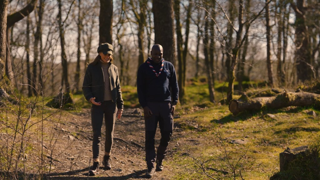 Kate Middleton and Dwayne Fields walking on a dirt path in the woods during their trip to the Lake District