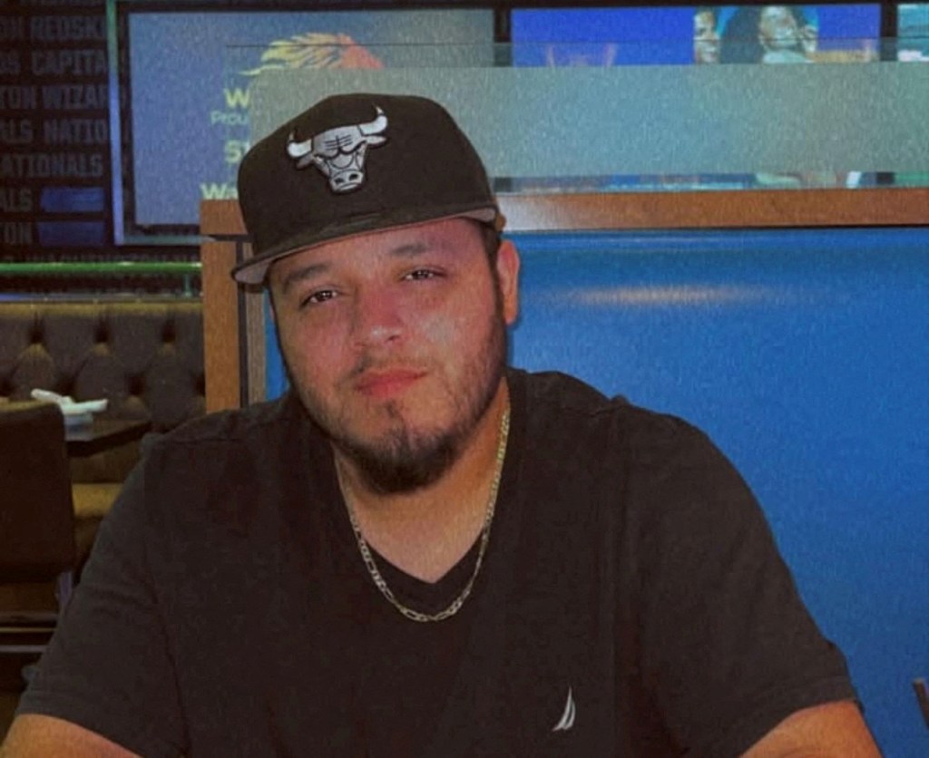 Kilmar Abrego Garcia, a Salvadoran migrant who was erroneously deported from the U.S., wearing a Chicago Bulls hat.