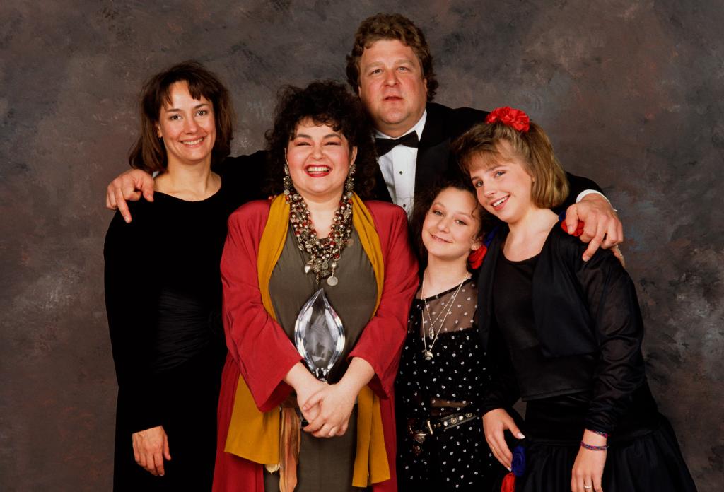 From left: Laurie Metcalf, Roseanne Barr, John Goodman, Sara Gilbert and Lecy Goranson pose backstage after winning the 1989 People's Choice Award for best TV Comedy. 