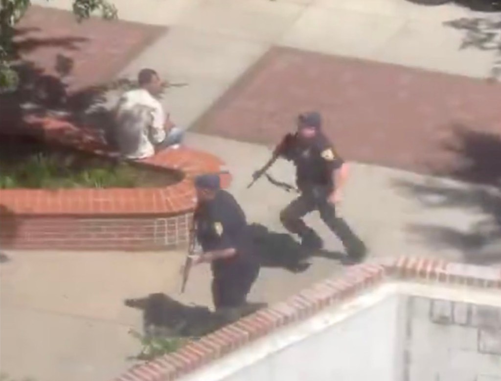 A group of police officers with guns responding to an active shooter report at Florida State University's Tallahassee campus