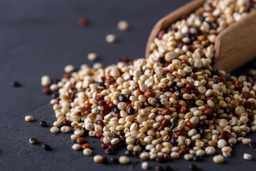 A mix of quinoa grains on a table. 
