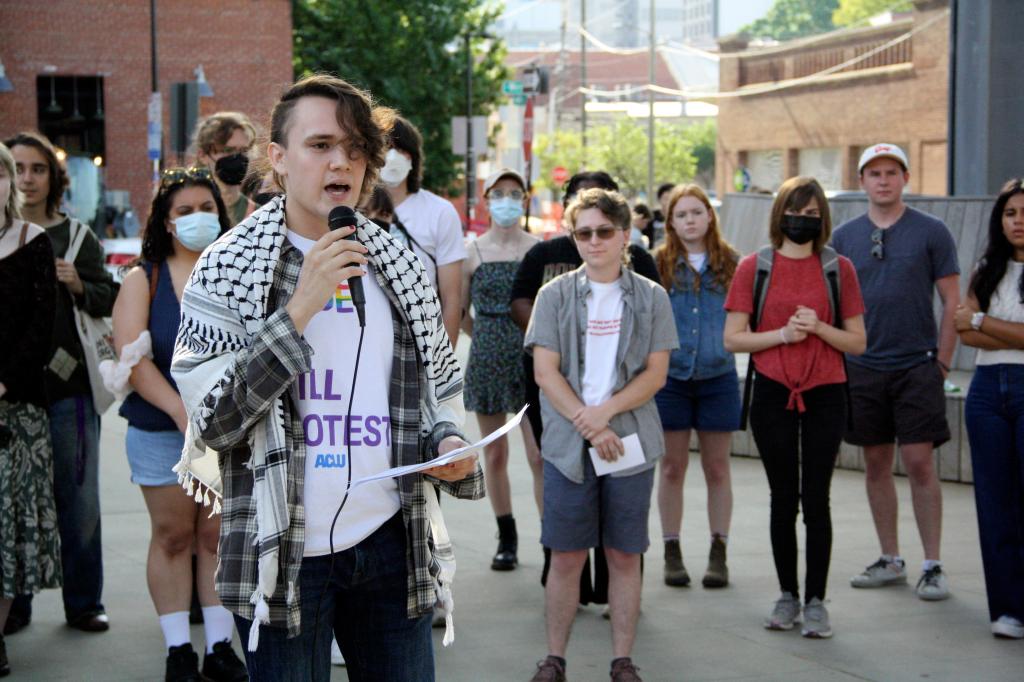 Nathaniel Dibble, a member of the Young Democratic Socialists of America at North Carolina State University, voices opposition to repealing North Carolina's public university system's diversity policy before the UNC Board of Governors' vote outside of the UNC system office in Raleigh, N.C., on Thursday, May 23, 2024. 