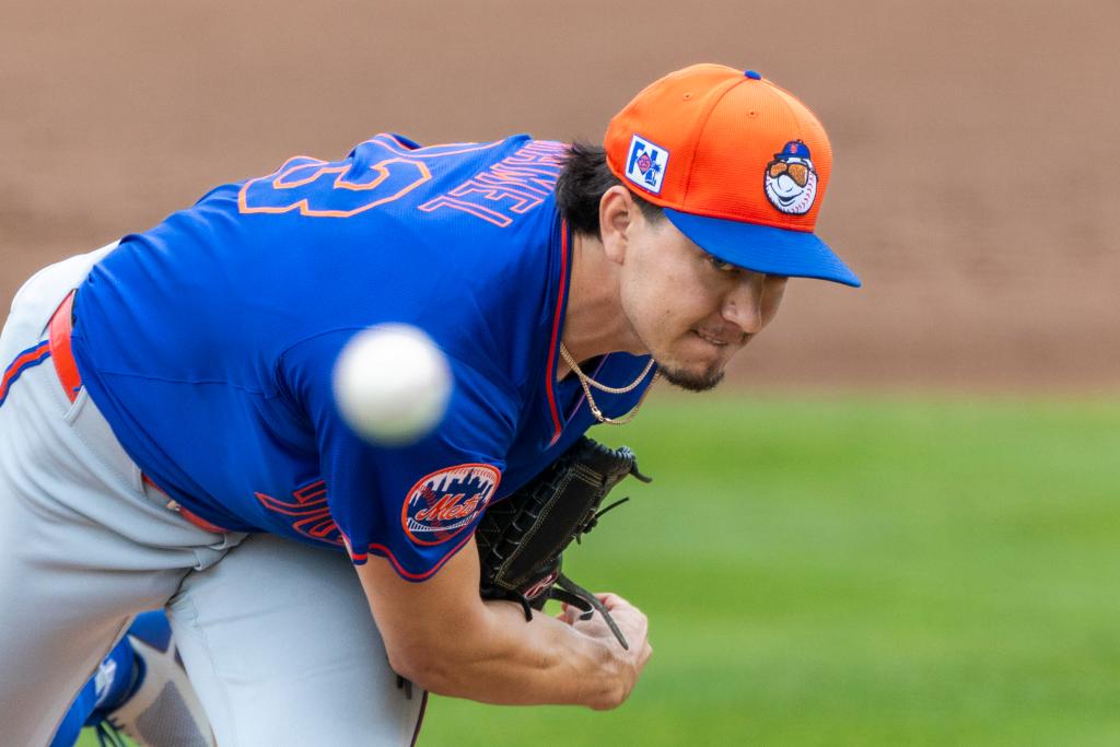 New York Mets pitcher Dominic Hamel throwing a ball during a spring training game against the St. Louis Cardinals at Roger Dean Stadium.