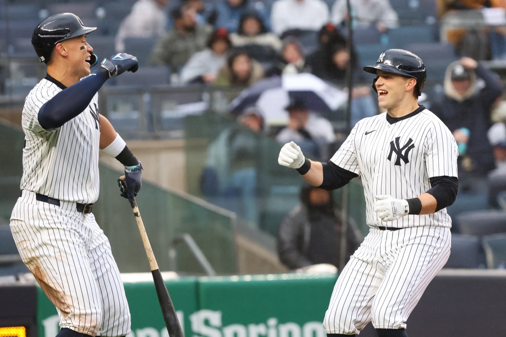 New York Yankees first baseman Ben Rice celebrating with outfielder Aaron Judge after hitting a solo home run against the San Francisco Giants at Yankee Stadium