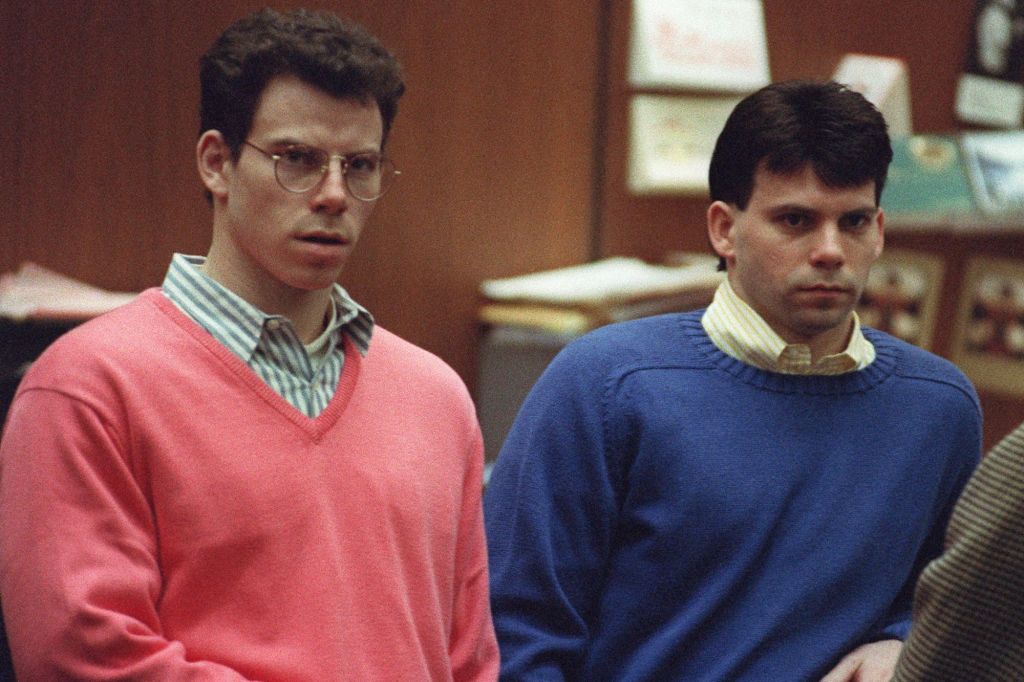 Erik Menendez (L) and his brother Lyle (R) listen during a pre-trial hearing, on December 29, 1992 in Los Angeles after the two pleaded innocent in the August 1989 shotgun deaths of their wealthy parents, Jose and Mary Louise Menendez of Beverly Hills, Calif