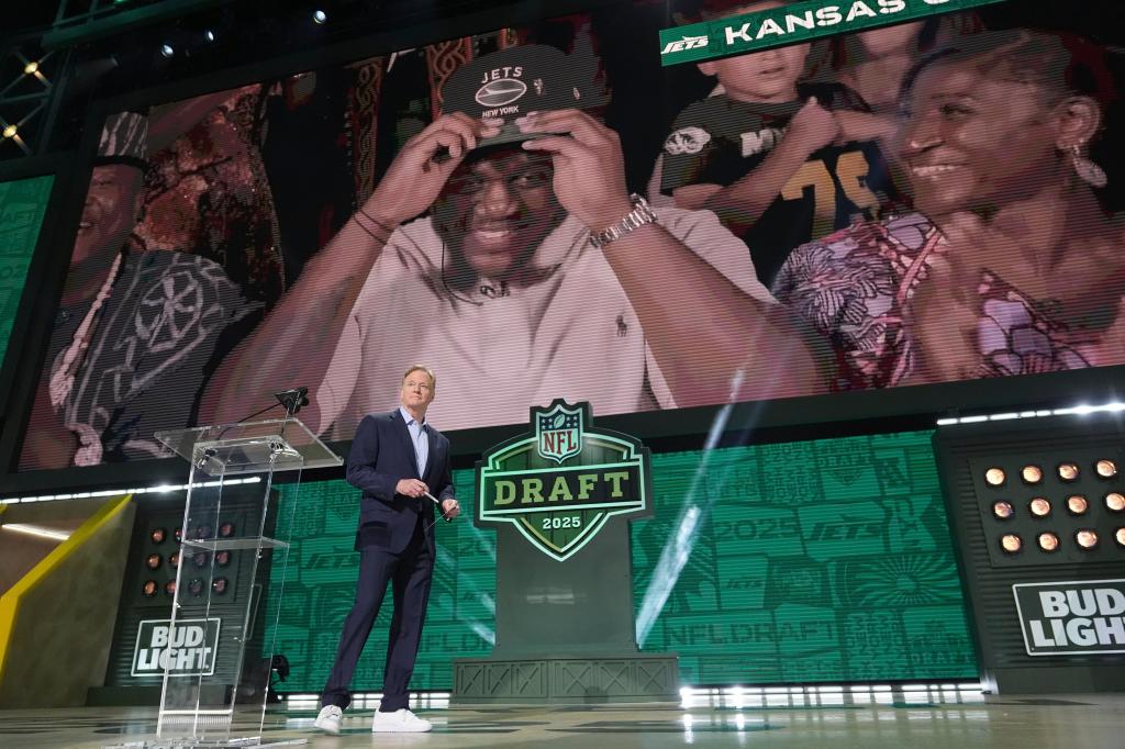 NFL Commissioner Roger Goodell on stage, announcing Armand Membou as the seventh overall pick for the New York Jets during NFL draft 2025