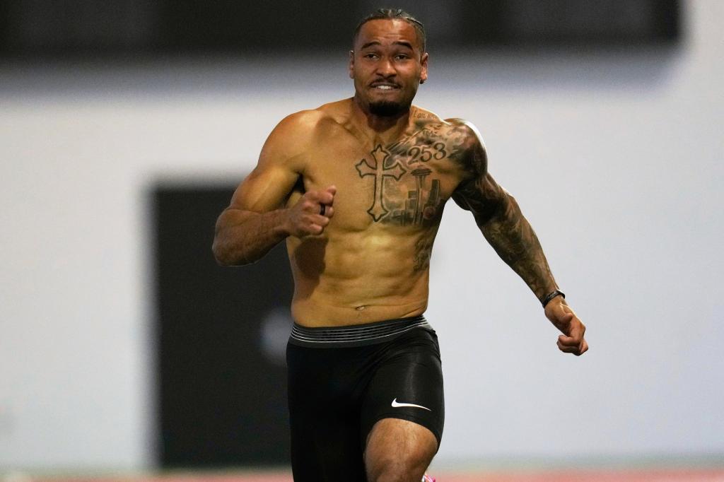 Emeka Egbuka runs the 40-yard dash at Ohio State's pro day on March 26, 2025. 