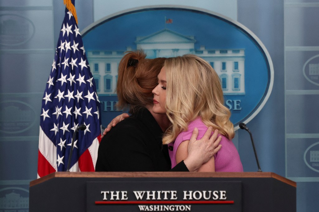 Morin is embraced by White House Press Secretary Karoline Leavitt.