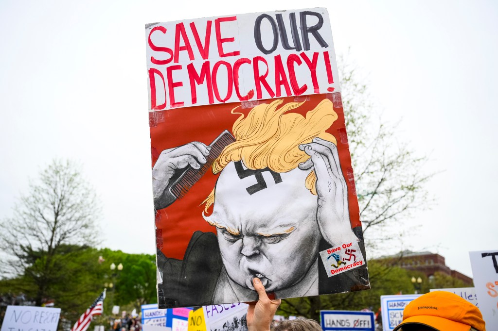 People gather on the National Mall to protest policies of the Trump administration, as well as Elon Musk's influence, in one of over a thousand rallies scheduled nationwide under the slogan Hands Off!, on April 5, 2025 in Washington, DC.