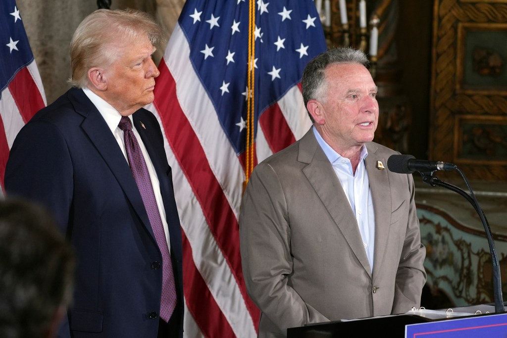 Donald Trump listens as Steve Witkoff speaks during a news conference at Mar-a-Lago, Jan. 7, 2025, in Palm Beach, Fla. 