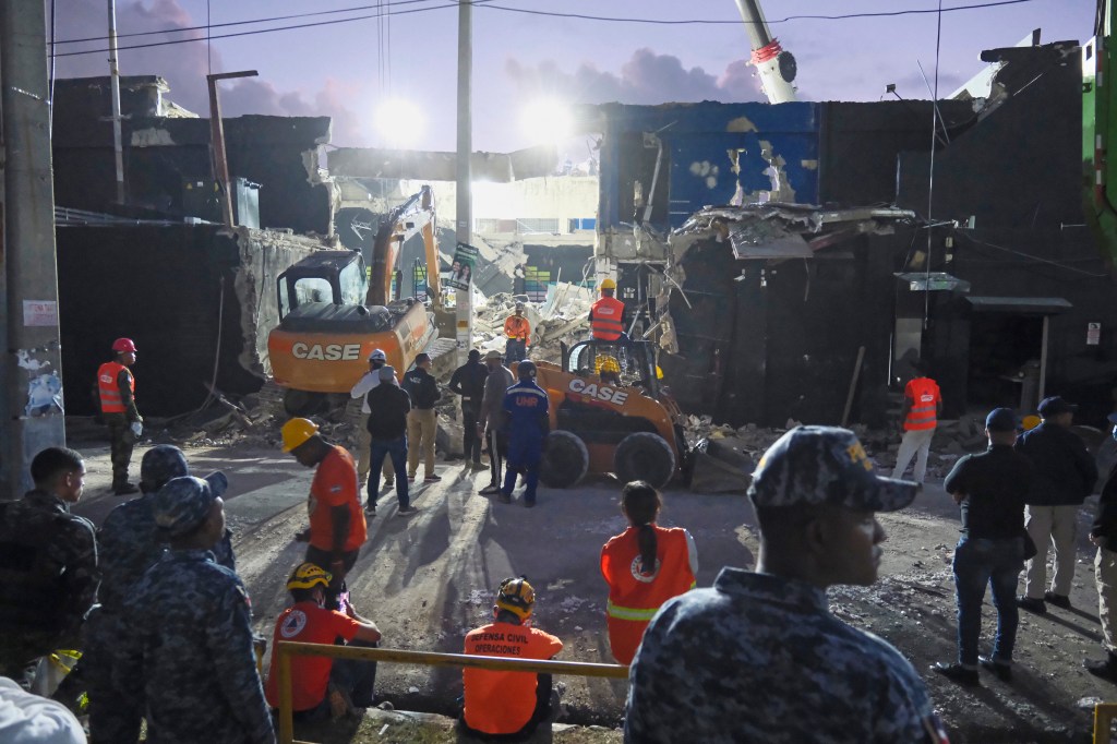 Rescue workers search for survivors at the Jet Set nightclub after its roof collapsed two nights prior during a merengue concert in Santo Domingo, Dominican Republic, Wednesday, April 9, 2025.