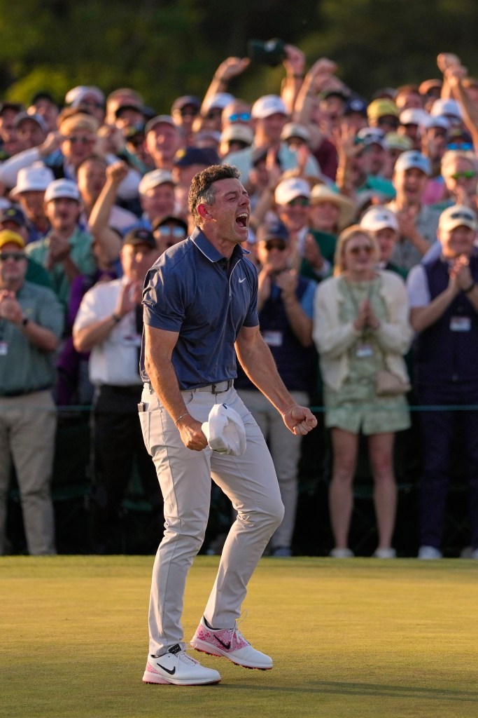 Rory McIlroy, of Northern Ireland, reacts after winning in a playoff against Justin Rose after the final round at the Masters golf tournament, Sunday, April 13, 2025, in Augusta, Ga.  