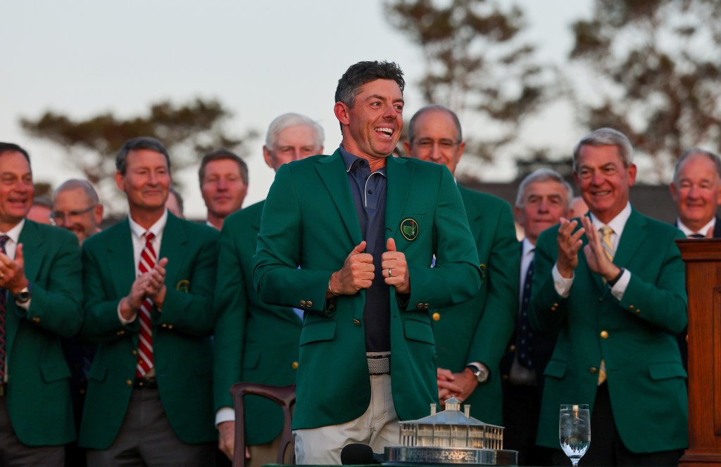 Rory McIlroy puts on the Green Jacket after winning the Masters.