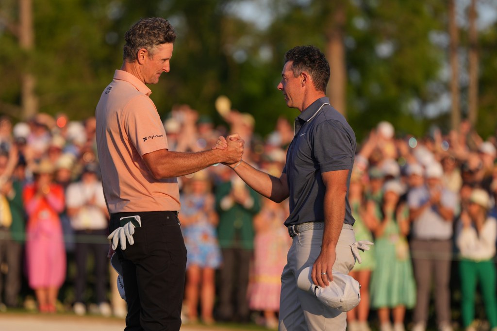Justin Rose (l) and rory McIlroy (r) after their sudden-death round.