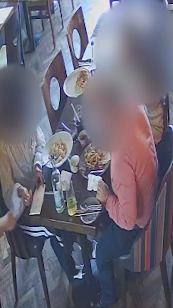 A man and woman were seen on camera planting glass in their meal before refusing to pay.