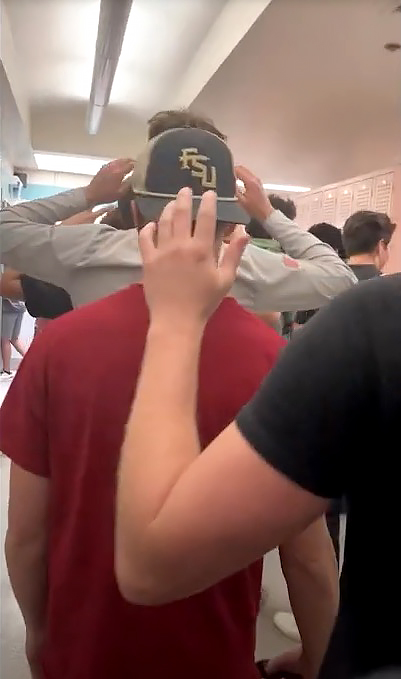 Students being escorted out of Florida State University locker rooms by law enforcement after a lockdown due to an active shooter incident
