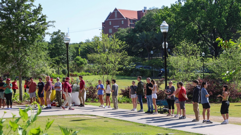 Students wait to retrieve their personal items from the Florida State Student Union building, Tallahassee, Fla., Friday, April 18, 2025.