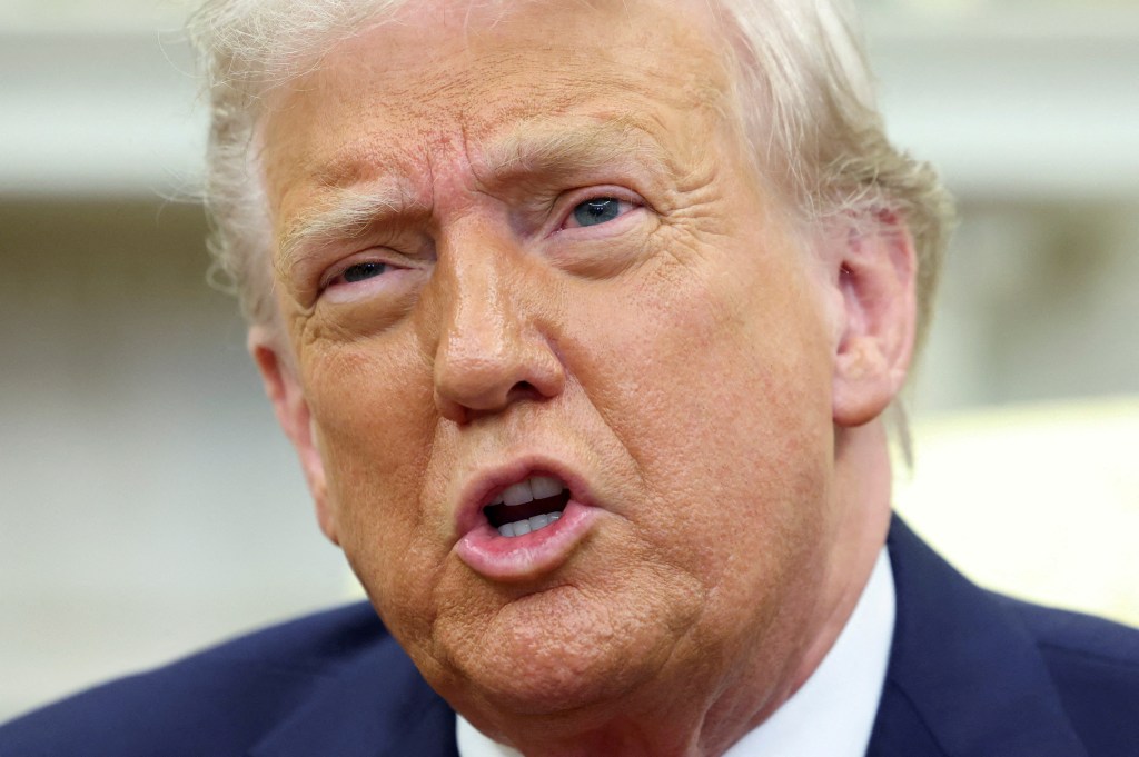U.S. President Donald Trump in a discussion in the Oval Office.