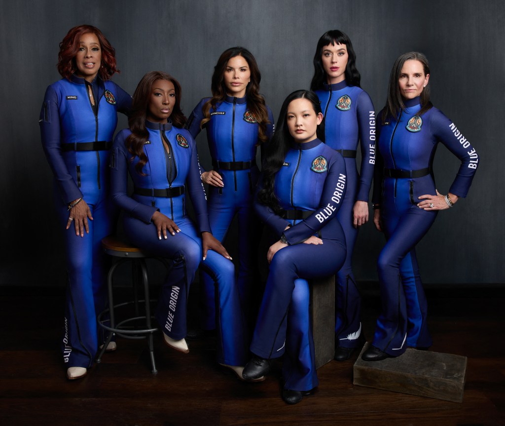 Gayle King, Aisha Bowe, Lauren Sanchez, Amanda Nguyen, Katy Perry, and Kerianne Flynn in Blue Origin spacesuits, posing before their all-woman sub-orbital mission.