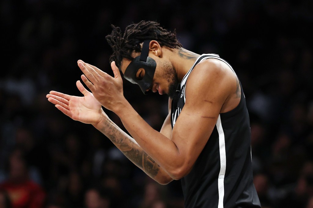 Nic Claxton of the Brooklyn Nets holding his hands up in reaction during a game against the Miami Heat at Barclays Center on February 07, 2025.